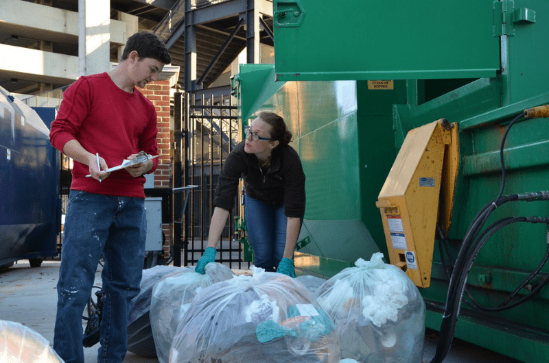 Recycling Staff at Dumpster