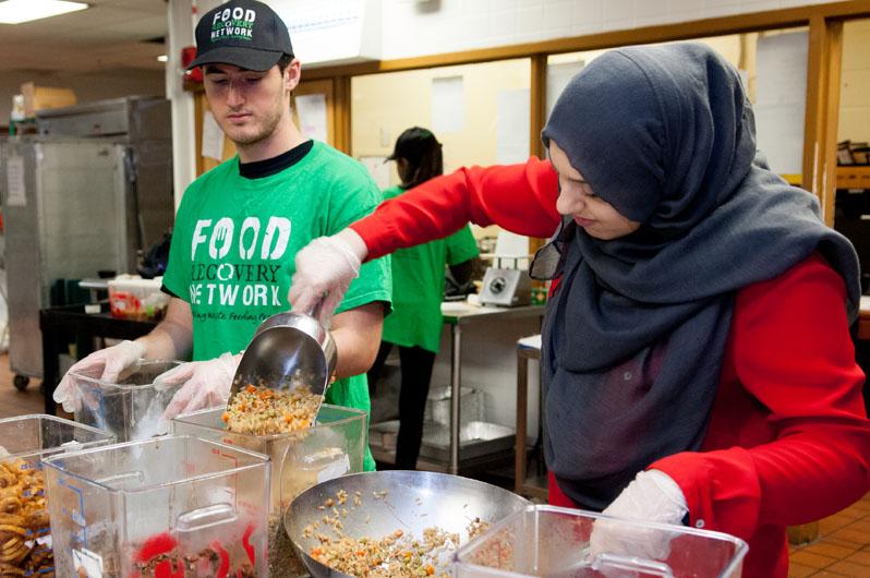 Students collecting leftover food